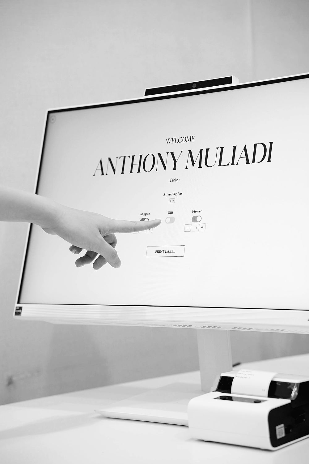 A guest's name shown on the Invitamu check-in screen as a host taps to confirm
